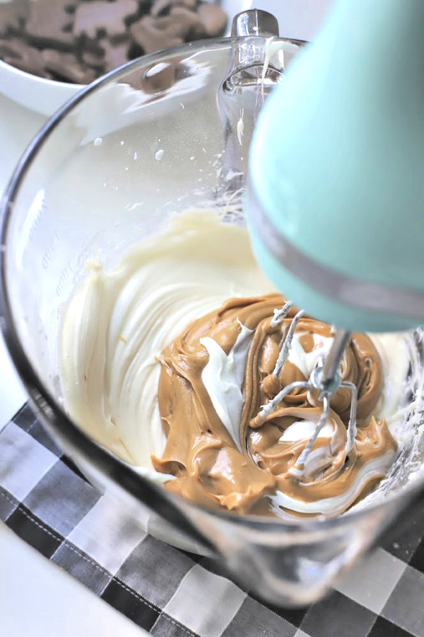 Easy recipe for no-bake peanut butter pie with cream cheese and whipped topping in a heavenly chocolate crust. Creamy, frosty and easily made from scratch!