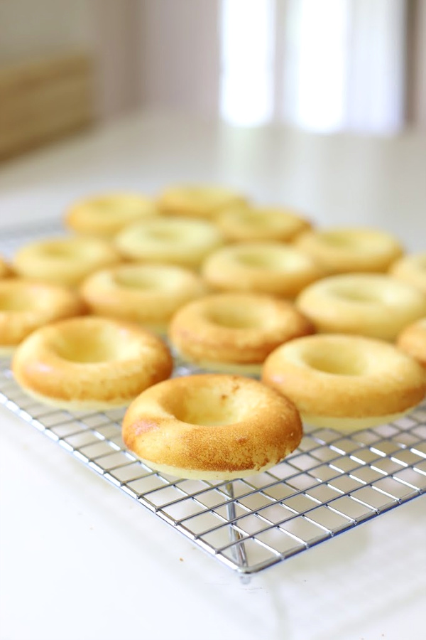 Make a batch of homemade baked cake donuts. Easy recipe and fun to make with kids or grandchildren. Add chocolate frosting, powered sugar, cinnamon sugar or just leave plain.