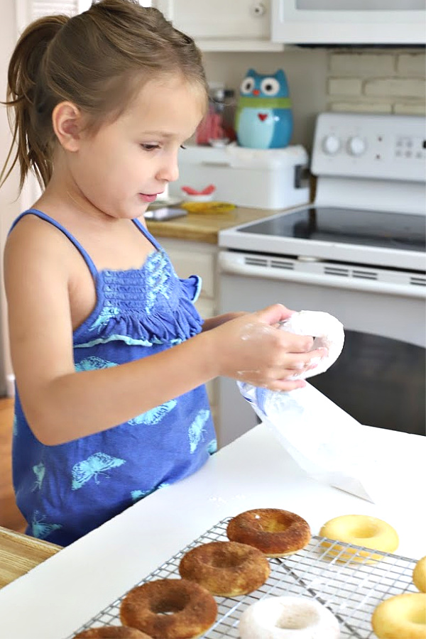 Make a batch of homemade baked cake donuts. Easy recipe and fun to make with kids or grandchildren. Add chocolate frosting, powered sugar, cinnamon sugar or just leave plain.