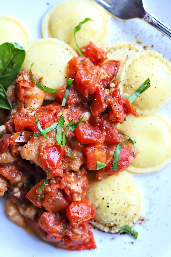 Serve scalloped tomatoes hot from the oven, as a side dish, an appetizer with chips or over ravioli or pasta. Easy recipe using fresh Roma tomatoes, basil leaves and toasted bread croutons for old-fashioned scalloped tomatoes.