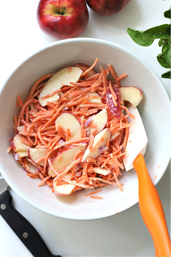 Easy recipe for making an apple carrot slaw that is crunchy, creamy and healthy.