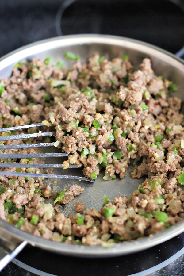 cooking sausage gravy in skillet