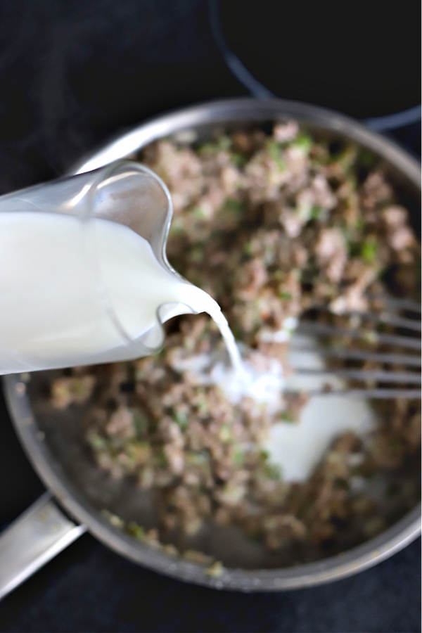 Adding milk to sausage gravy