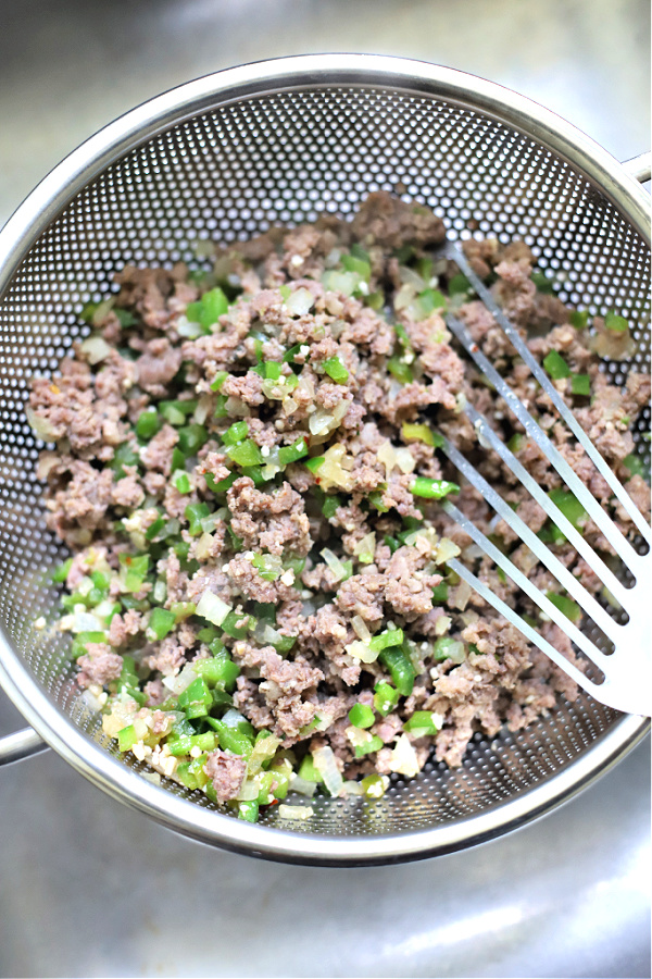 draining the sausage and bell pepper for sausage gravy country sausage gravy