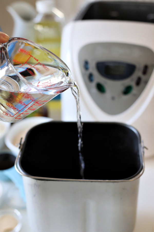 Adding water to bread machine for dark brown yeast bread