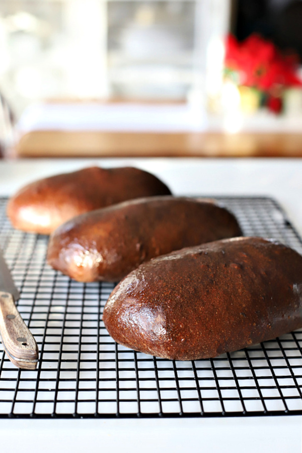 Honey wheat, dark brown bread is an easy recipe using a bread machine for the dough. Slightly sweet from molasses similar to Outback loaves.