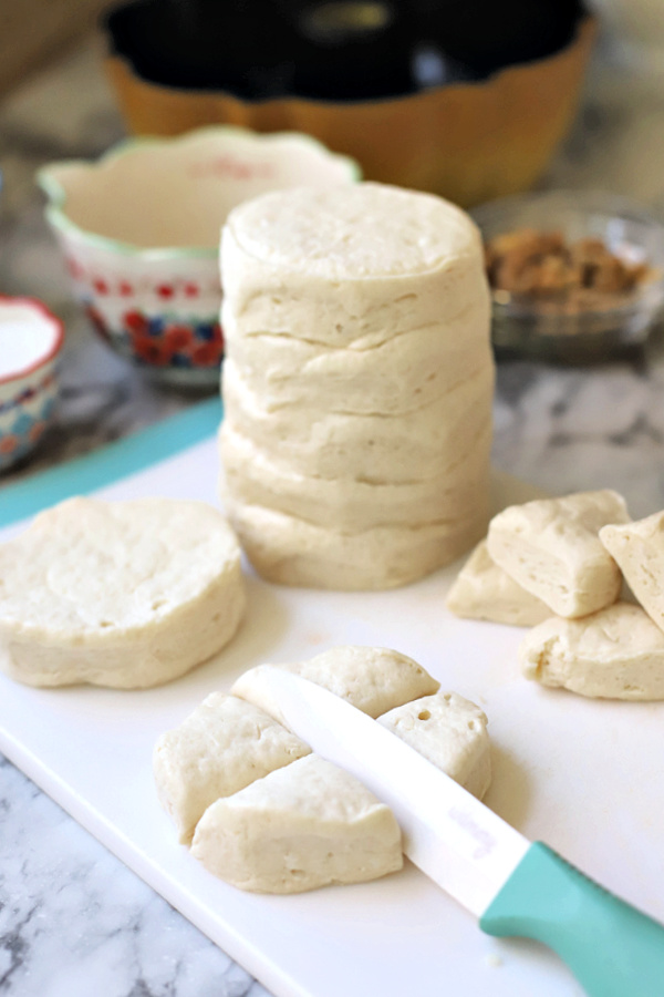 Cutting biscuits for homemade monkey bread