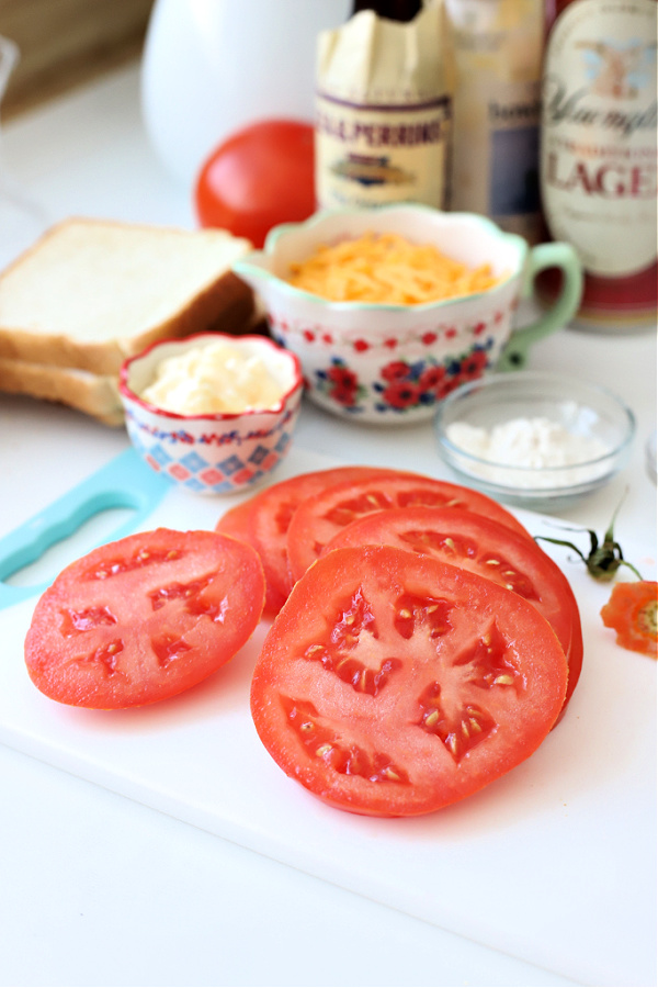 Sliced tomatoes for Welsh Rarebit