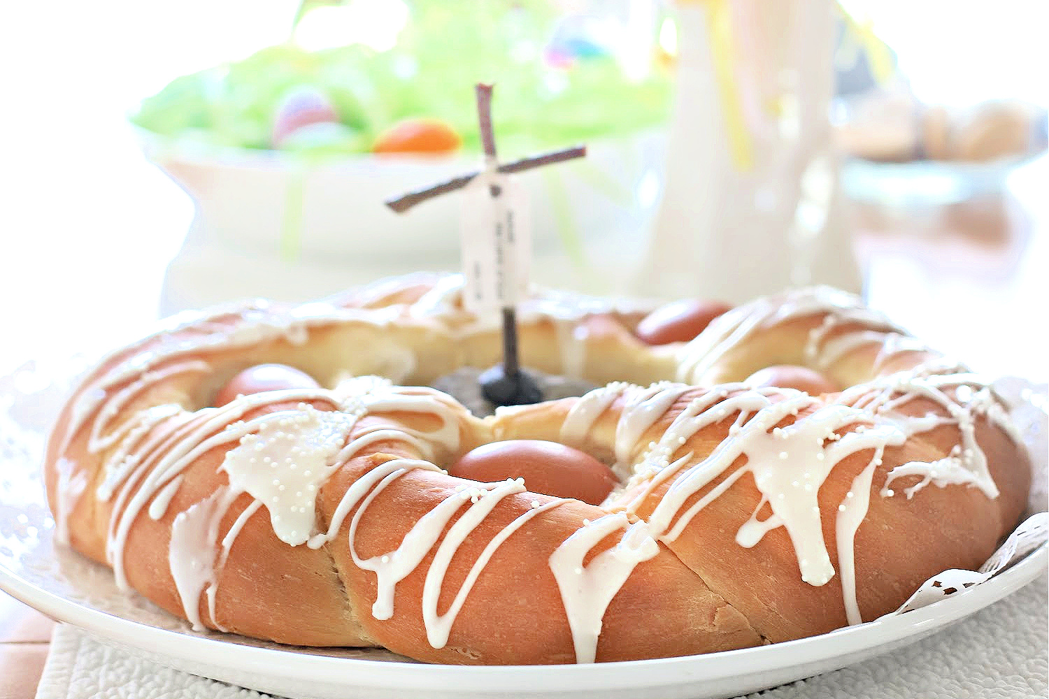 Make a beautiful Easter bread with natural or dyed eggs using a bread maker for the sweet dough.