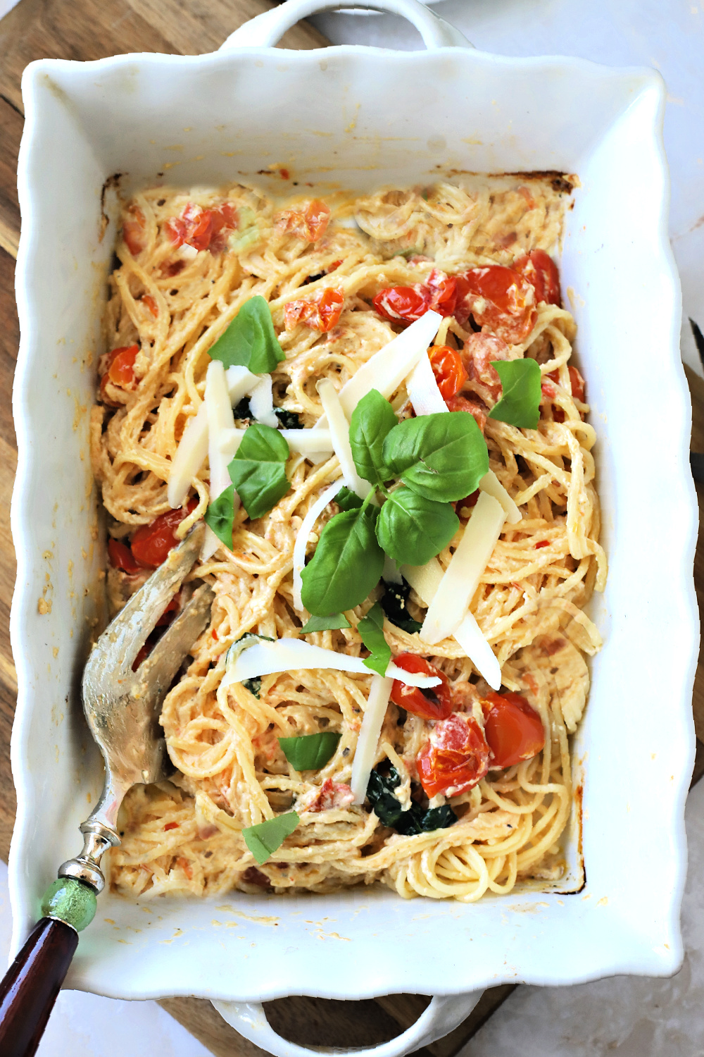 Easy & tasty recipe for baked tomato & feta perfect for pasta. Seen on TicTok, cherry tomatoes are roasted with olive oil and seasoning. 