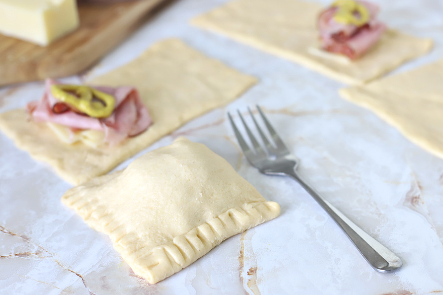 crimping crescent roll dough with a fork