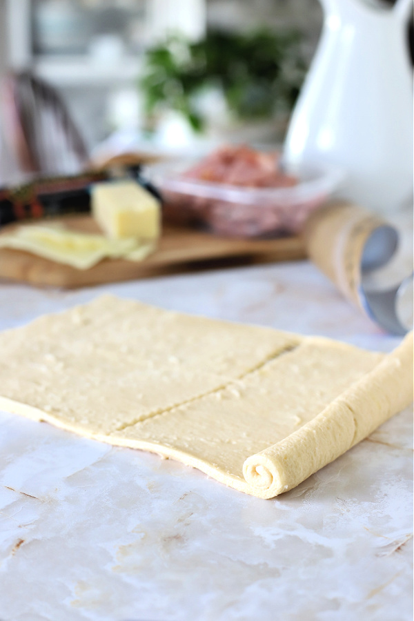 unrolling crescent roll dough