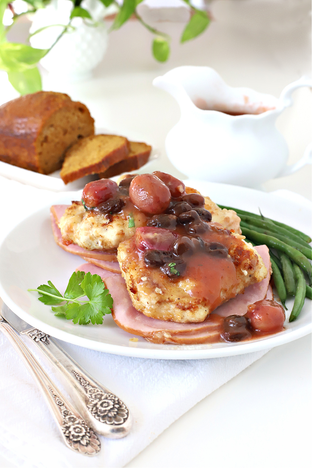 This dinner entrée looks elegant and involved but it is and easy recipe to make. Chicken breast is coated with panko or cracker crumbs and sautéed in a pan. The grape sauce with raisins cooks quickly in a small saucepan. Plate and serve as is or on top of sliced ham.