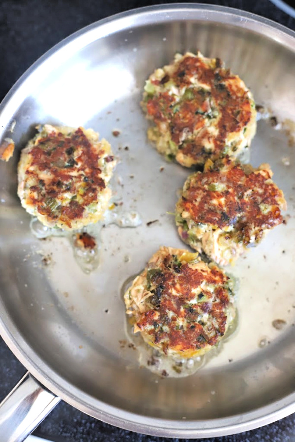 Easy recipe for golden brown pan-fried fresh salmon patties with chopped veggies, mayo and Old Bay. Serve these cakes with a tasty tartar sauce.