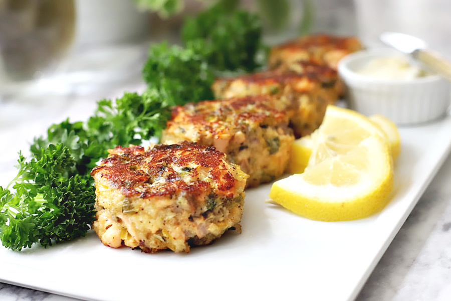 Easy recipe for golden brown pan-fried fresh salmon patties with chopped veggies, mayo and Old Bay. Serve these cakes with a tasty tartar sauce.