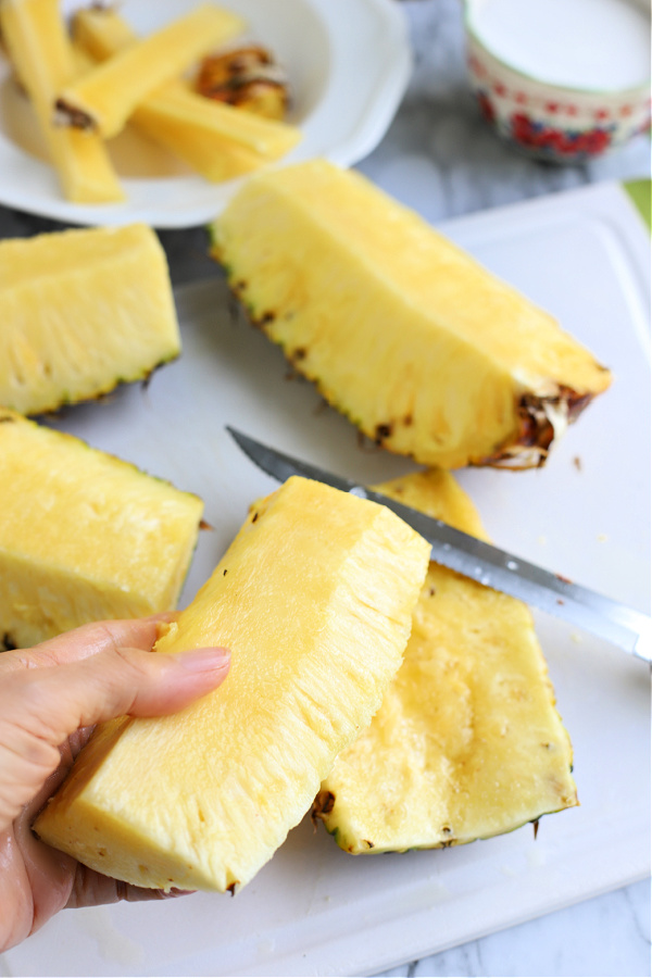 cutting a fresh pineapple