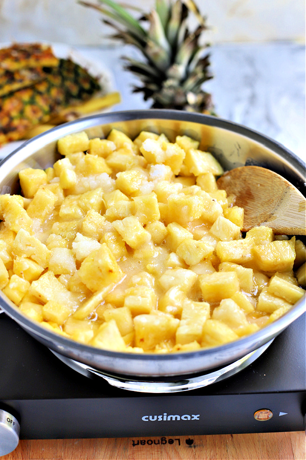 simmering fresh pineapple with sugar for Pineapple jam