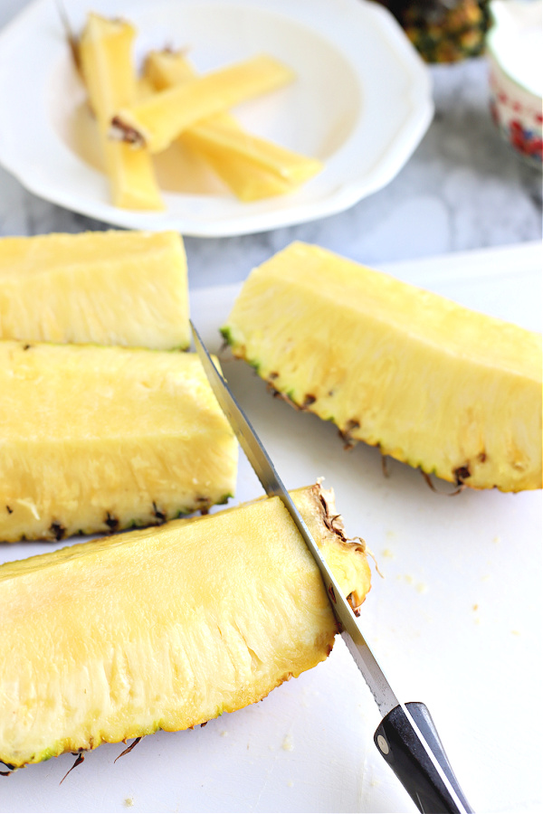 cutting a fresh pineapple