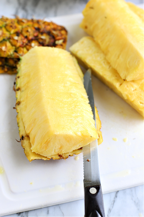 cutting a fresh pineapple