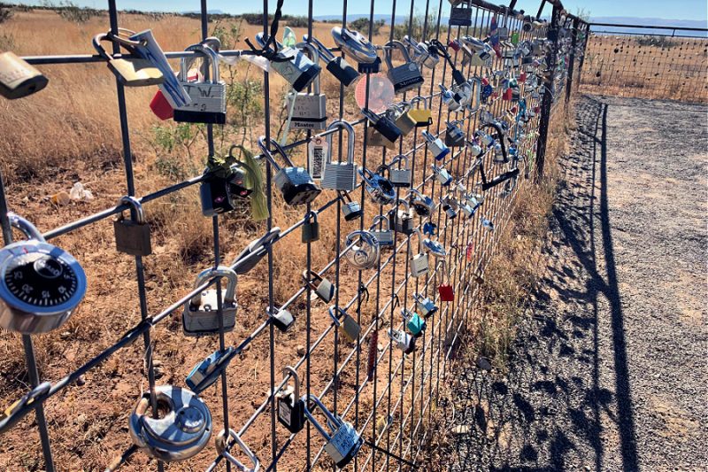 Locks on fence at Marfa Prada Artsy roadside Americana Texas highway