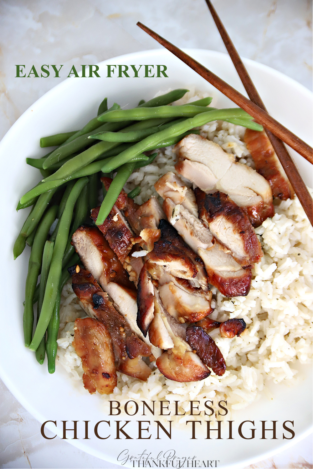 Two easy recipes for skinless, boneless chicken thighs made in an air fryer. Marinated honey ginger Asian and a simple basted BBQ version.