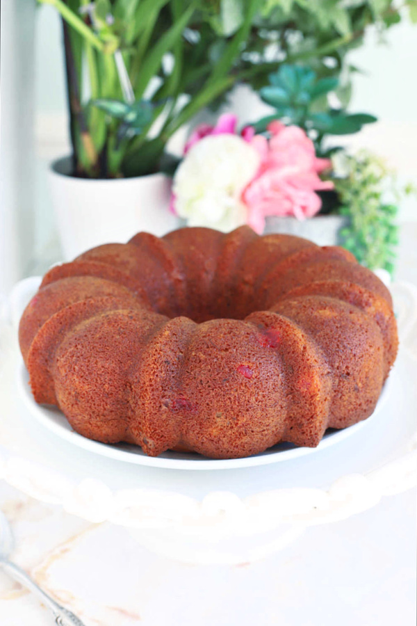 Easy hummingbird Bundt cake with banana, pineapple and cherries.