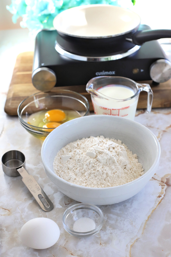 Ingredients for making crepes for manicotti pasta shells.