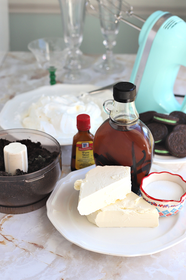 Ingredients for minty chocolate cheesecake parfait St Patrick's Day dessert.