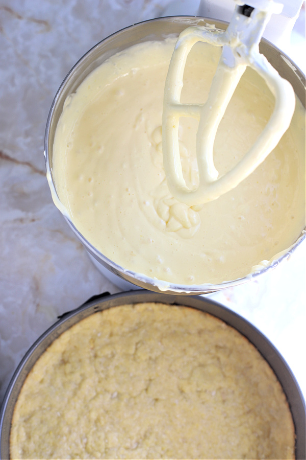 Mixing the cream cheese filling for NY style cheesecake recipe.