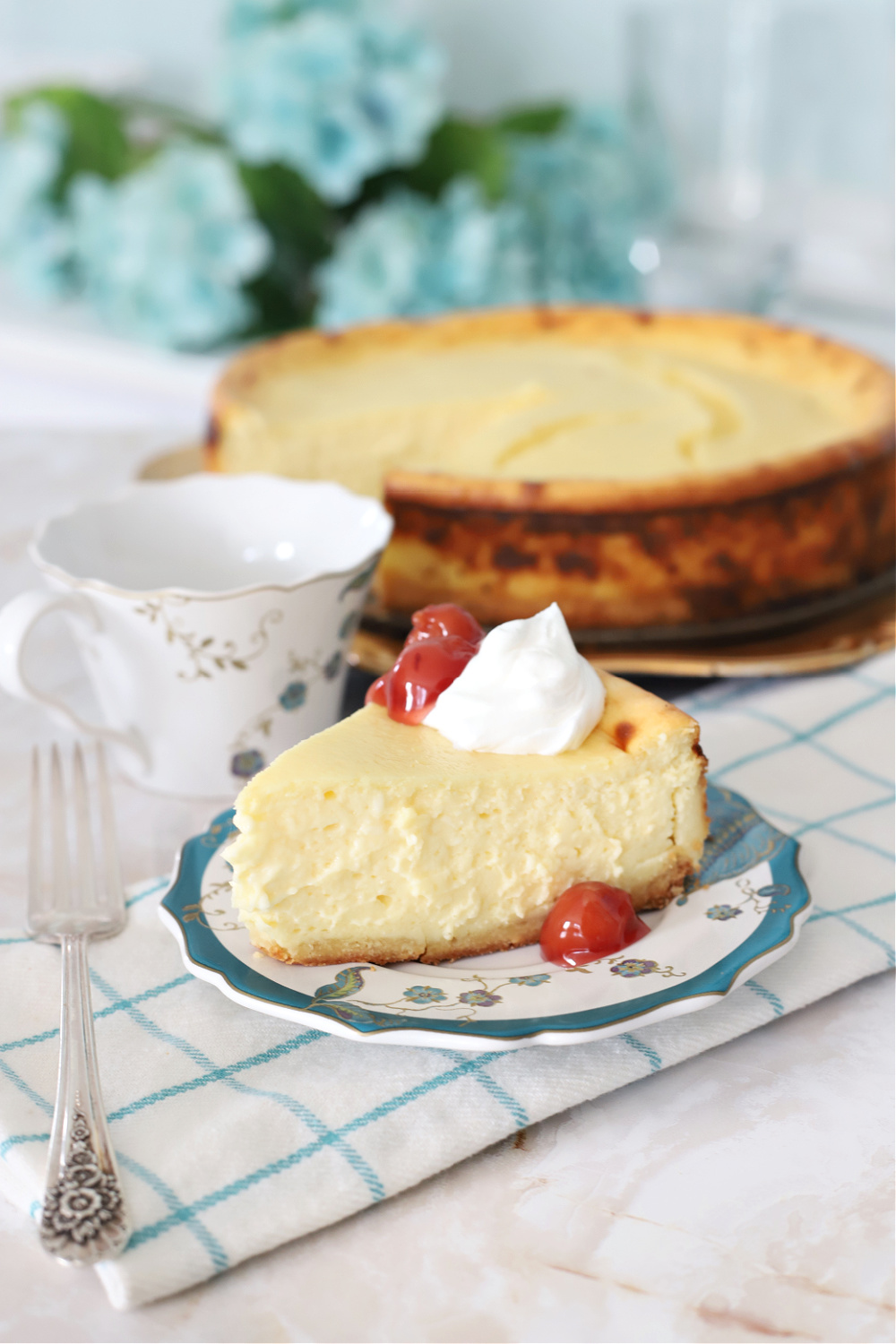 Rich and ultra creamy, Philadelphia NY style cheesecake. Recipe uses lots of cream cheese cream, eggs with a hint of almond and lemon citrus.