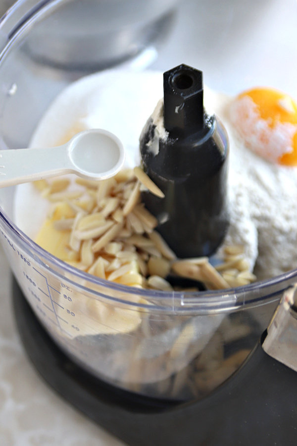 Adding vanilla and almond extract for the NY style cheesecake crust.