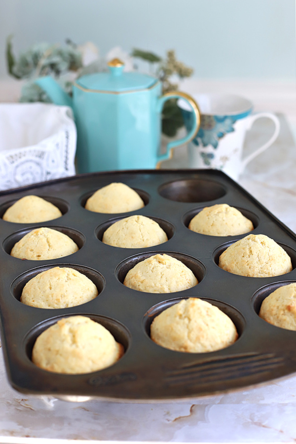 Allowing the baked basic muffins t cool in the tin.