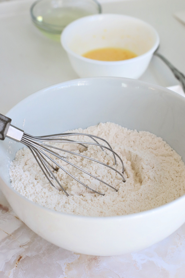 Combining the dry ingredients for making basic muffins.