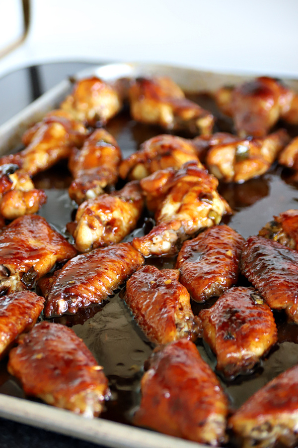 Basting honey garlic soy sauce chicken wings appetizer recipe.