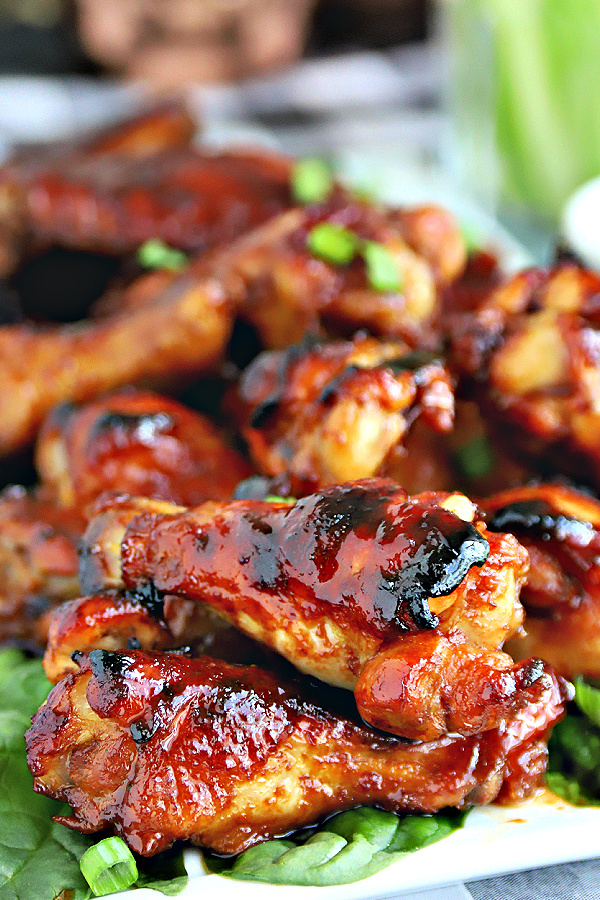 Easy appetizer recipe for honey glazed chicken wings with a sweet and sticky garlic and soy sauce that are baked rather than fried.