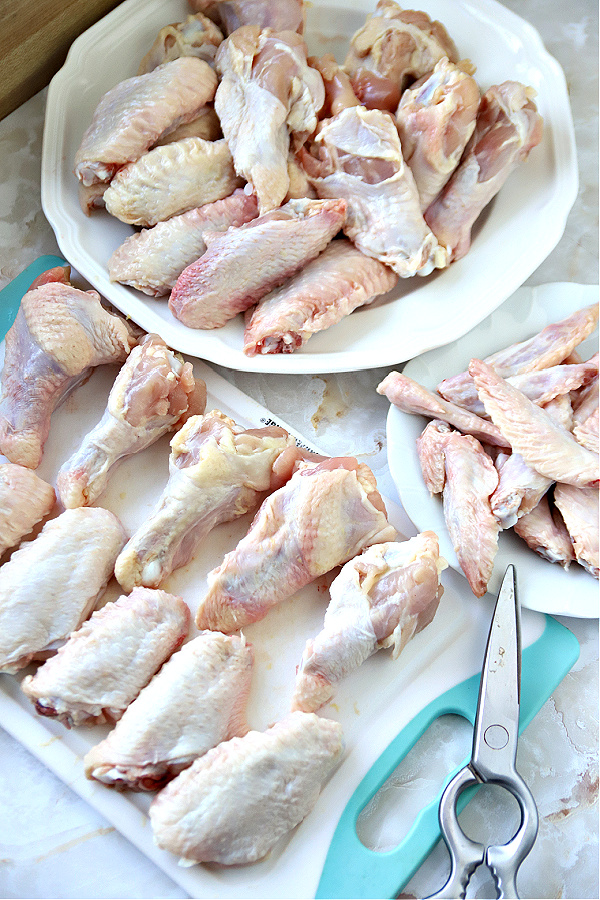 Separated sections, drumette, wingettes/flats and tips for making honey garlic sticky baked chicken wings recipe.