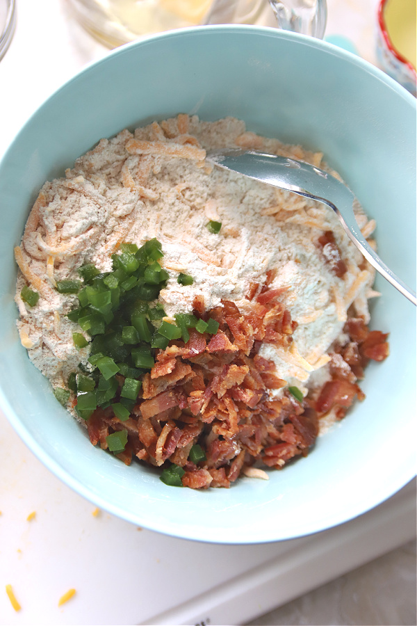 Adding grated sharp cheddar cheese to the cheese bacon whet germ quick bread recipe