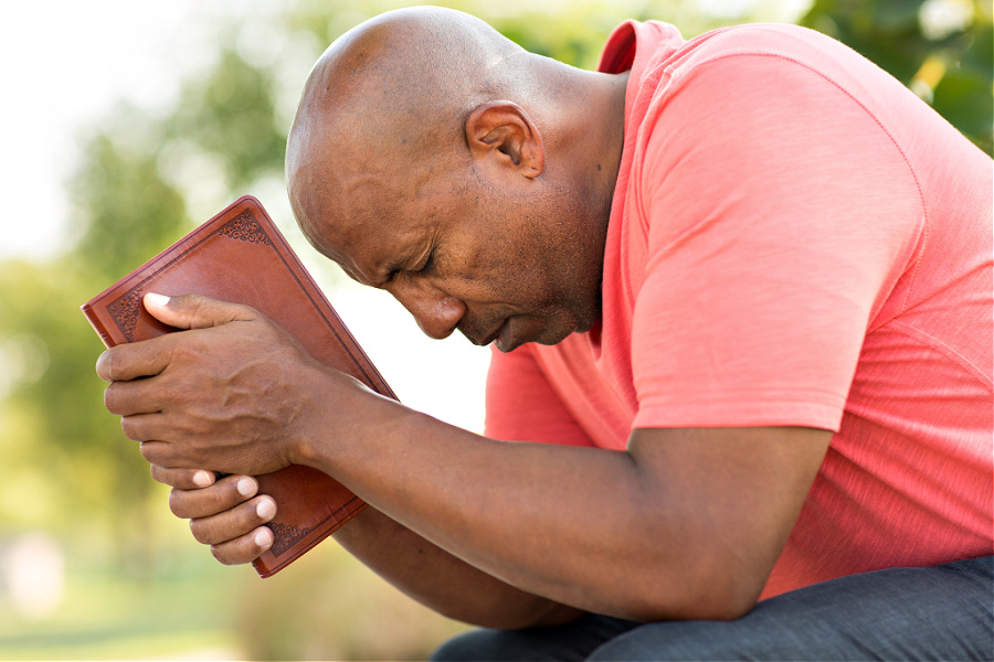 dad praying for his adult children