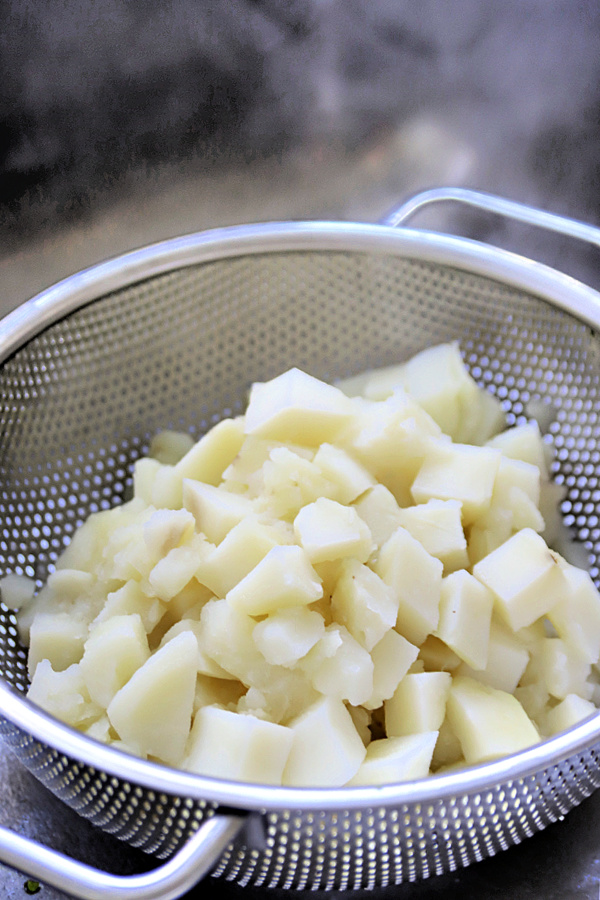 Boiled potatoes for bangers and mash.