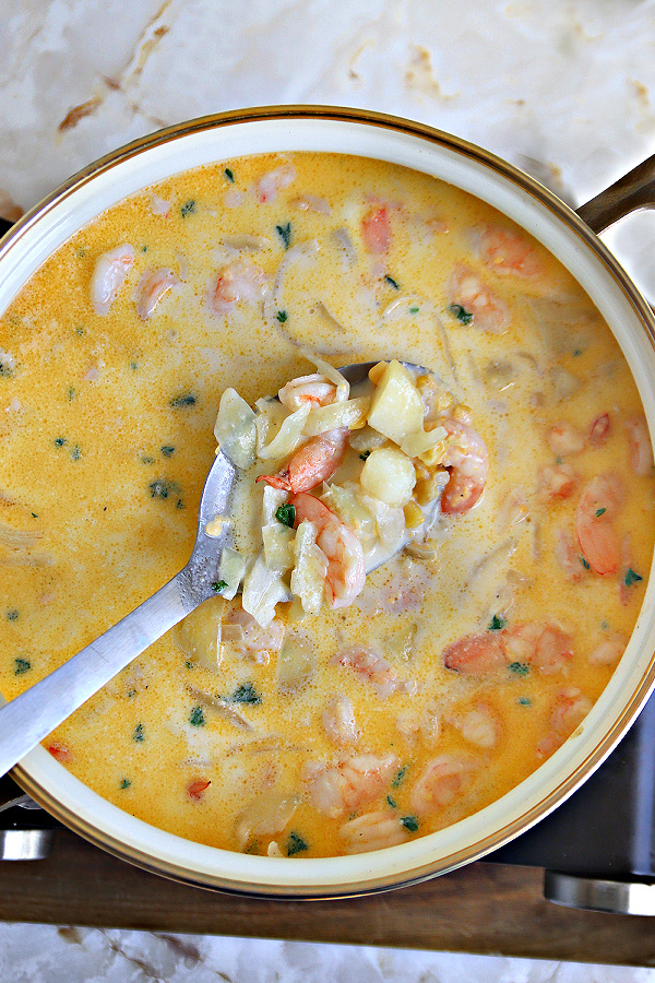 Pot of delicious homemade shrimp and corn chowder soup.