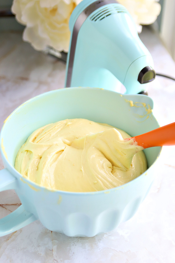 Making the batter for lemon sheet cake with cream cheese frosting.