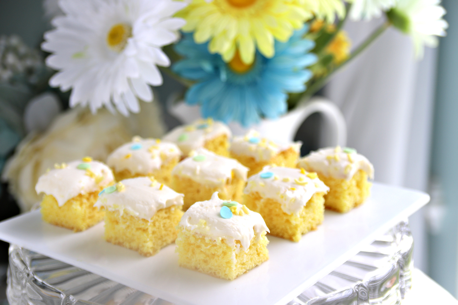 Quick and easy recipe for a moist lemon sheet cake begins with a box mix and lemon curd. Topped with a yummy cream cheese frosting.