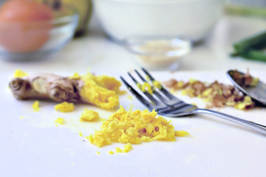 Grating fresh ginger for ground pork meatballs with bulgogi sauce