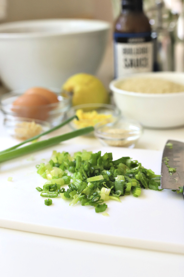 Chopping fresh scallions for ground pork meatballs with bulgogi sauce