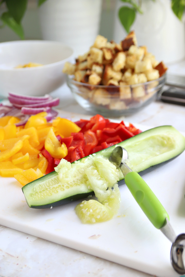 Prepping hothouse cucumbers for Greek Panzanella salad.