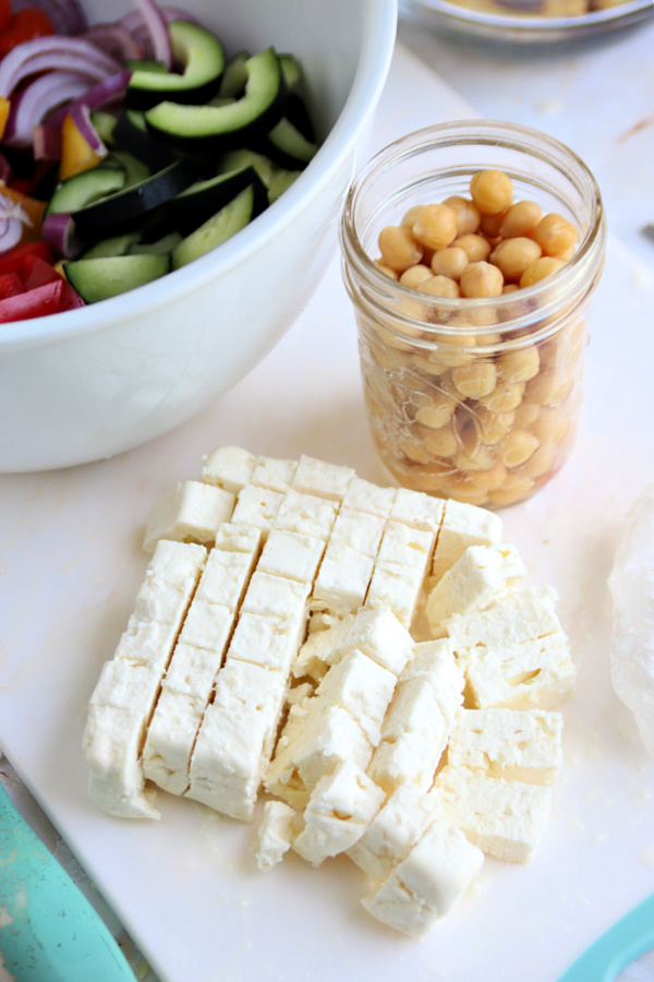 Fetta cheese and chick peas for Greek panzanella salad recipe.