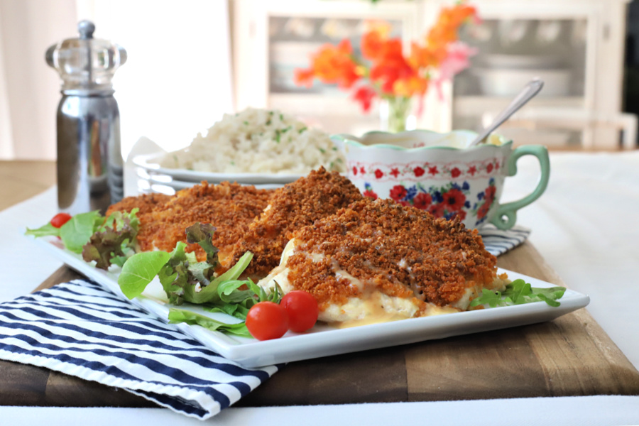 Parmesan crusted chicken with honey mustard sauce is oven baked rather than fried and delicious with a crunchy panko breadcrumb topping.