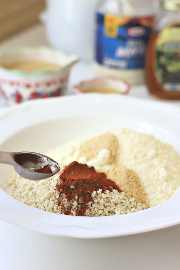 Easy recipe for juicy chicken breasts with a crispy Parmesan and panko coating. Oven baked rather than fried, Parmesan crusted chicken is drizzled with honey mustard sauce.