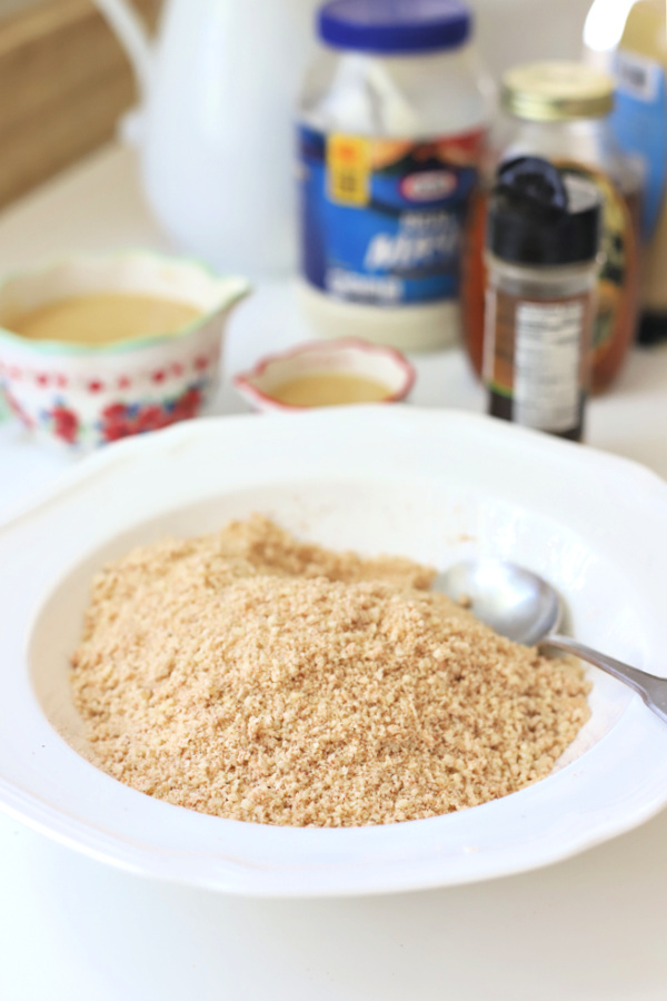 Easy recipe for juicy chicken breasts with a crispy Parmesan and panko coating. Oven baked rather than fried, Parmesan crusted chicken is drizzled with honey mustard sauce.